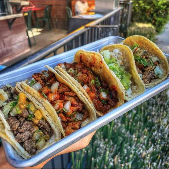A tray at the Atwater window: asada, al pastor, carnitas, and the vegetarian jackfruit.