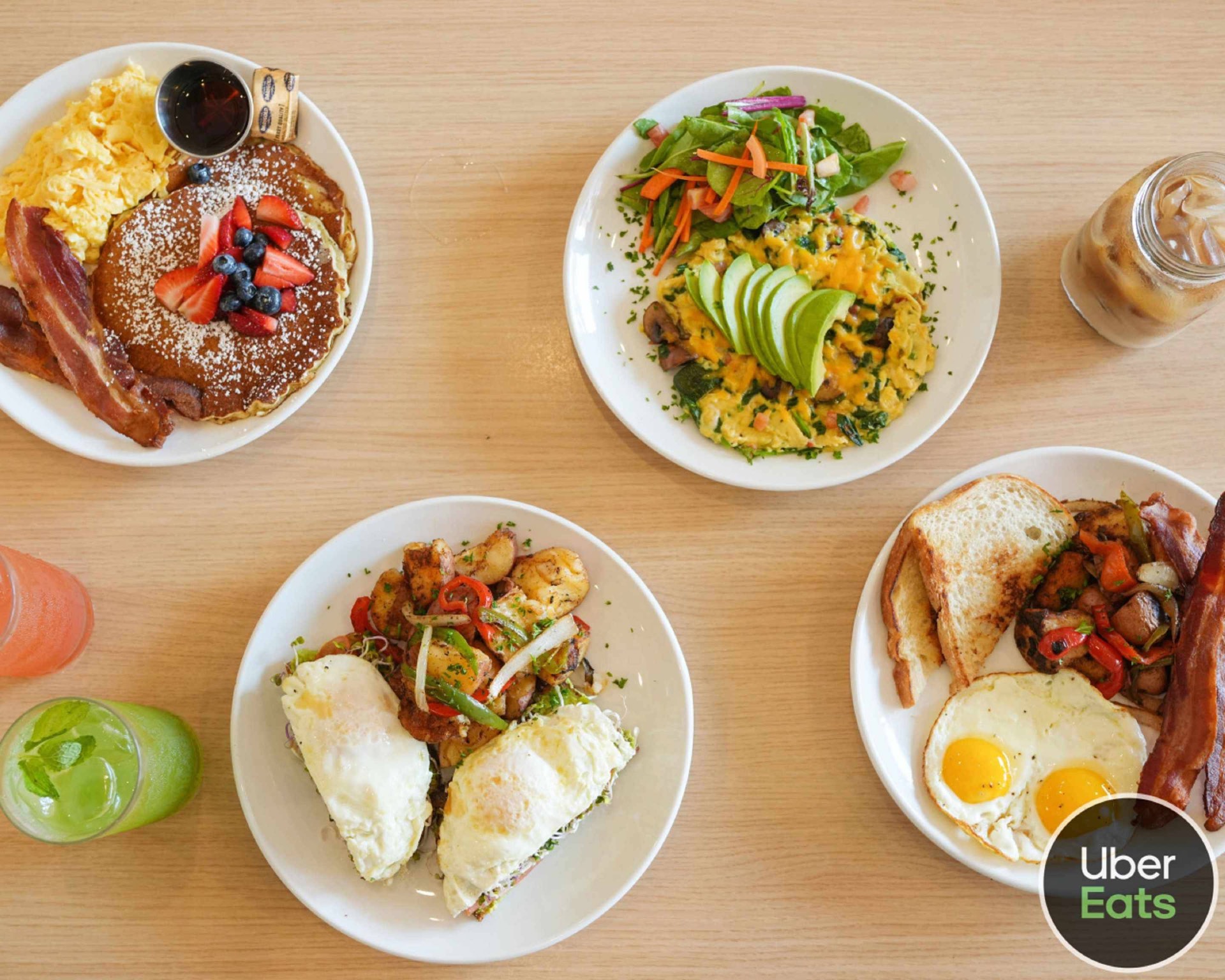 A weekend spread on the patio — chilaquiles, the pancake stack, veggie scramble, and the seasonal aguas frescas.